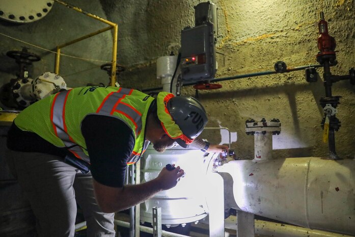 A Joint Task Force-Red Hill (JTF-RH) civilian inspects a fuel pump prior to beginning the drainage of the surge tanks at the Red Hill Bulk Fuel Storage Facility (RHBFSF) at Joint Base Pearl Harbor-Hickam, Hawaii, July 17, 2023. JTF-RH is in phase three of its five-phase defueling plan. Personnel are focused on completing quality control tasks, training, response preparation, the National Environmental Policy Act Environmental Assessment, regulatory approvals and operational planning for all future major milestones. This extensive preparatory work will help ensure the safe and expeditious defueling of the RHBFSF. (DoD photo by U.S. Army Sgt. Kyler L. Chatman)