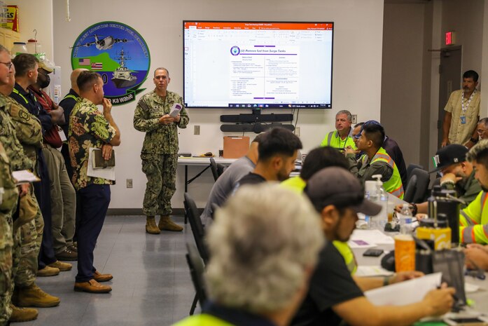 Joint Task Force Red-Hill (JTF-RH) Fuels Director, U.S. Navy Capt. Shawn Triggs, briefs JTF-RH military, civilian, and contractor personnel prior to starting to drain the surge tanks at the Red Hill Bulk Fuel Storage Facility at Joint Base Pearl Harbor-Hickam, Hawaii, July 17, 2023. JTF-RH is in phase three of its five-phase defueling plan. Personnel are focused on completing quality control tasks, training, response preparation, the National Environmental Policy Act Environmental Assessment, regulatory approvals and operational planning for all major milestones. This extensive preparatory work will help ensure the safe and expeditious defueling of the RHBFSF. (DoD photo by U.S. Army Sgt. Kyler L. Chatman)