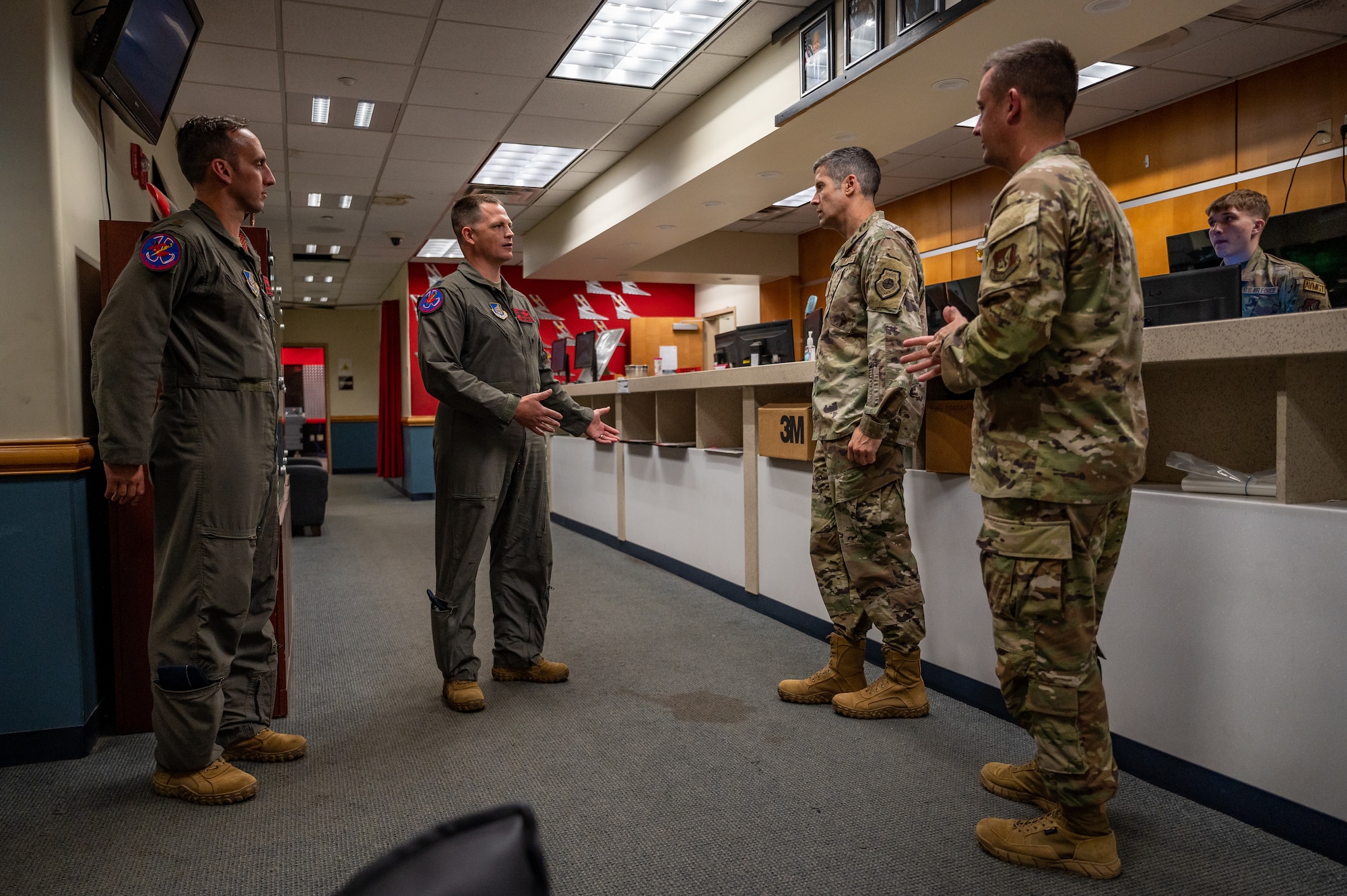 U.S. Air Force Col. William McKibban, 51st Fighter Wing commander, and Chief Master Sgt. Joshua Trundle, 51 FW command chief, speak with Lt. Col. Cory Farrer, 36th Fighter Squadron commander, at Osan Air Base, Republic of Korea, July 7, 2023. McKibban and Trundle have been participating in squadron immersion tours since taking command of the 51st FW on June 20, 2023. (U.S. Air Force photo by Senior Airman Thomas Sjoberg)