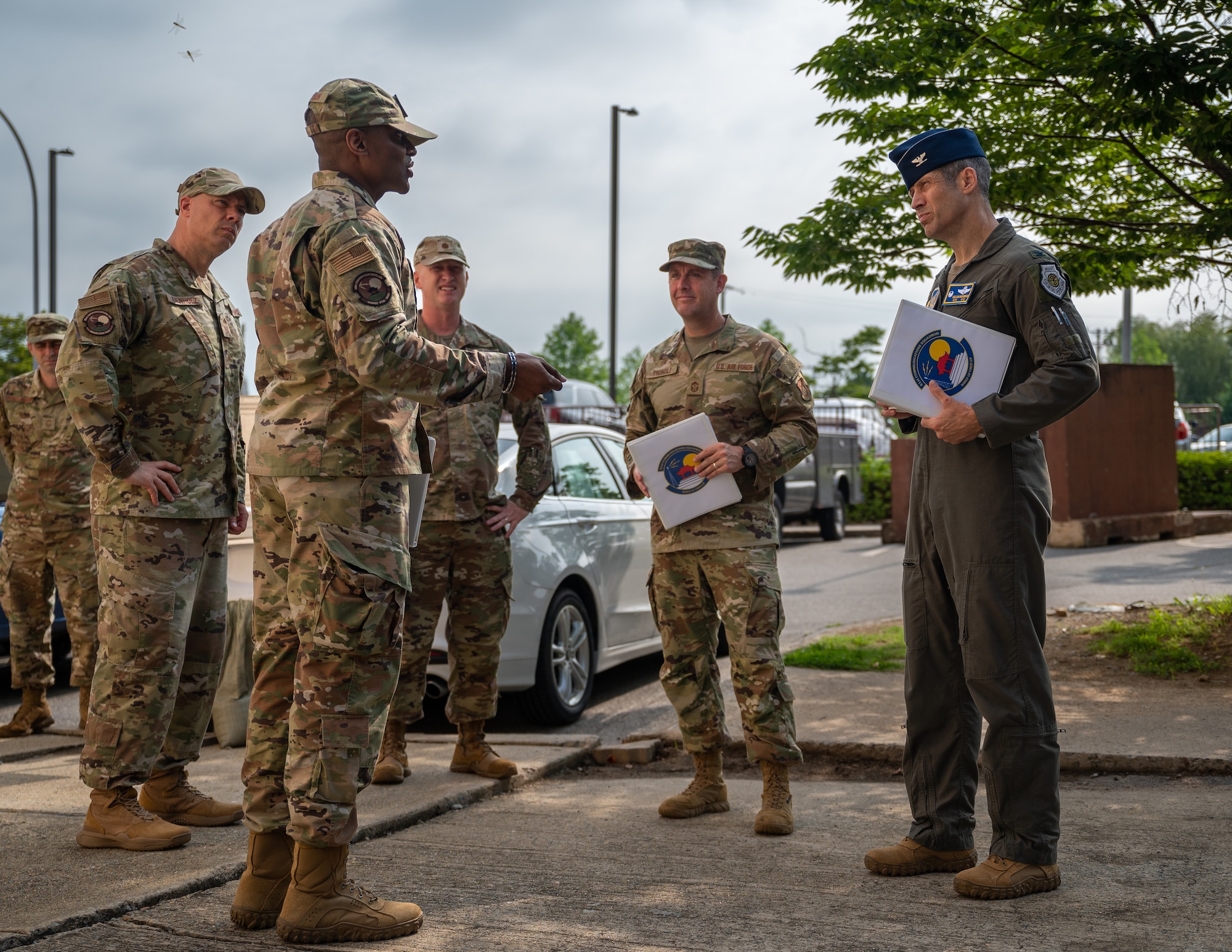 U.S. Air Force Col. William McKibban, right, 51st Fighter Wing commander, and Chief Master Sgt. Joshua Trundle, 51 FW command chief, speak with members of the 51st Communications Squadron at Osan Air Base, Republic of Korea, July 10, 2023. By experiencing the day-to-day operations and the dedication of their squadron members, new command teams can identify areas for improvement, make informed decisions and tailor their leadership approach to ensure readiness and cohesiveness are maximized. (U.S. Air Force photo by Senior Airman Thomas Sjoberg)