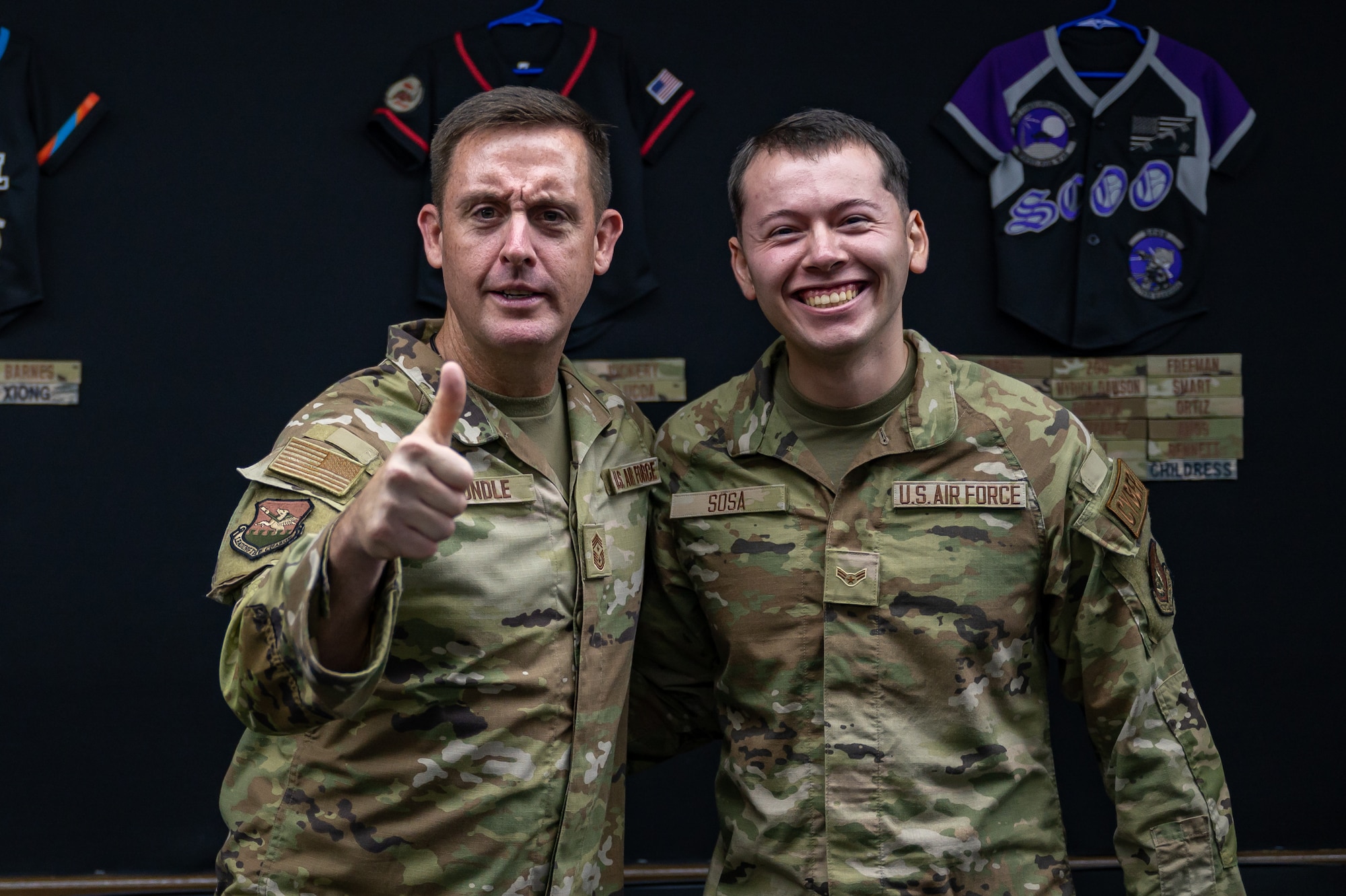 U.S. Air Force Chief Master Sgt. Joshua Trundle, 51st Fighter Wing command chief, poses for a photo with Airman 1st Class Enrique Sosa, 51st Communications Squadron knowledge operations technician, at Osan Air Base, Republic of Korea, July 10, 2023. Engaging directly with Airmen allows new command teams to build essential bonds of trust and appreciation for their invaluable contributions to mission success. (U.S. Air Force photo by Senior Airman Thomas Sjoberg)