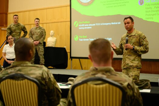  Tech Sgt. Thomas Stewart present an innovation idea to judges during a Spark Tank event at Hll Air Force Base, Utah, May 25, 2023. The event was part of the 2023 HAFB Innovation Days held May 22-25. The event featured training sessions, speakers and panels designed to help participants navigate the innovation ecosystem and help solve Department of the Air Force problems. (U.S. Air Force photo by R. Nial Bradshaw)