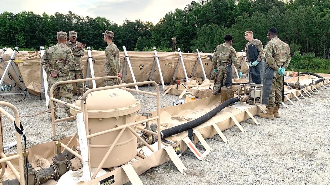 military Reservists examine fuel supply system