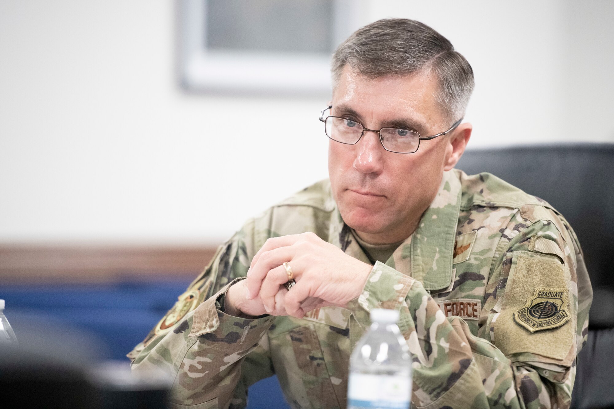 A general leans on a table