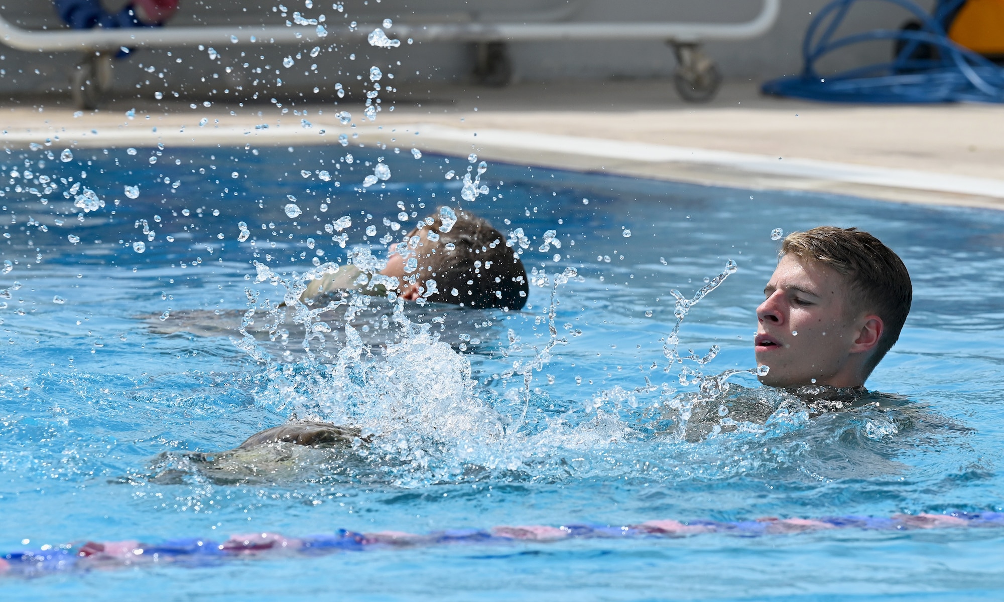 A photo of two men in the pool.