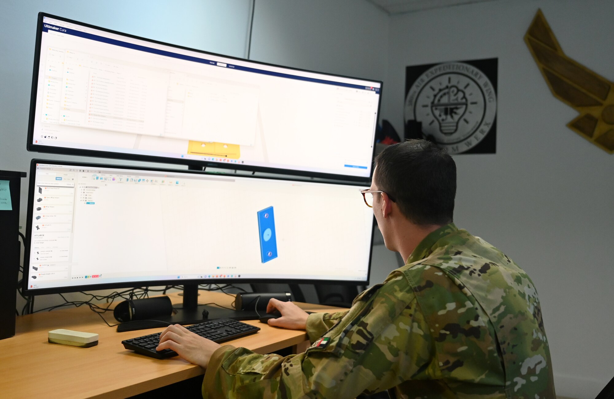 A photo of a man working on a computer.