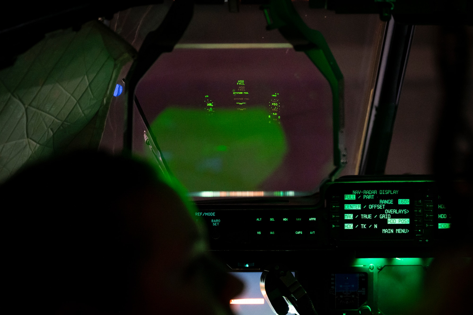 The heads up display in the pilot seat of an aircraft is visible for attendees during the tour.