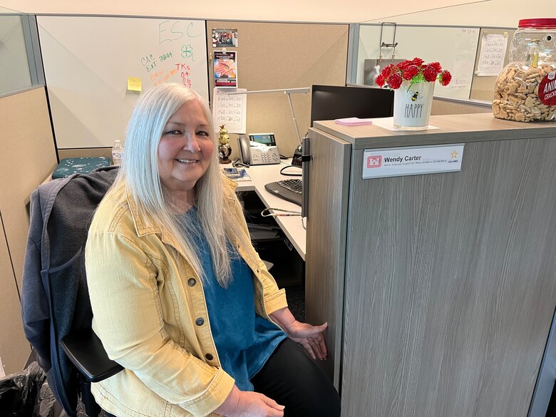 Woman working at desk.