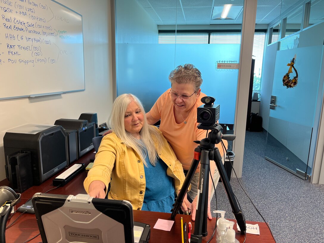 Two women working at a desk.