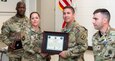 Staff Sgt. Frank E. Kiler, second from right, a small group leader who teaches the Advanced Leader Course at the Eastern Army National Guard Aviation Training Site Noncommissioned Officers Academy, won the Noncommissioned Officer Academies Small Group Leader of the Year.