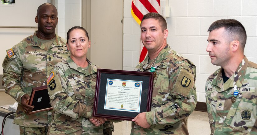 Staff Sgt. Frank E. Kiler, second from right, a small group leader who teaches the Advanced Leader Course at the Eastern Army National Guard Aviation Training Site Noncommissioned Officers Academy, won the Noncommissioned Officer Academies Small Group Leader of the Year.
