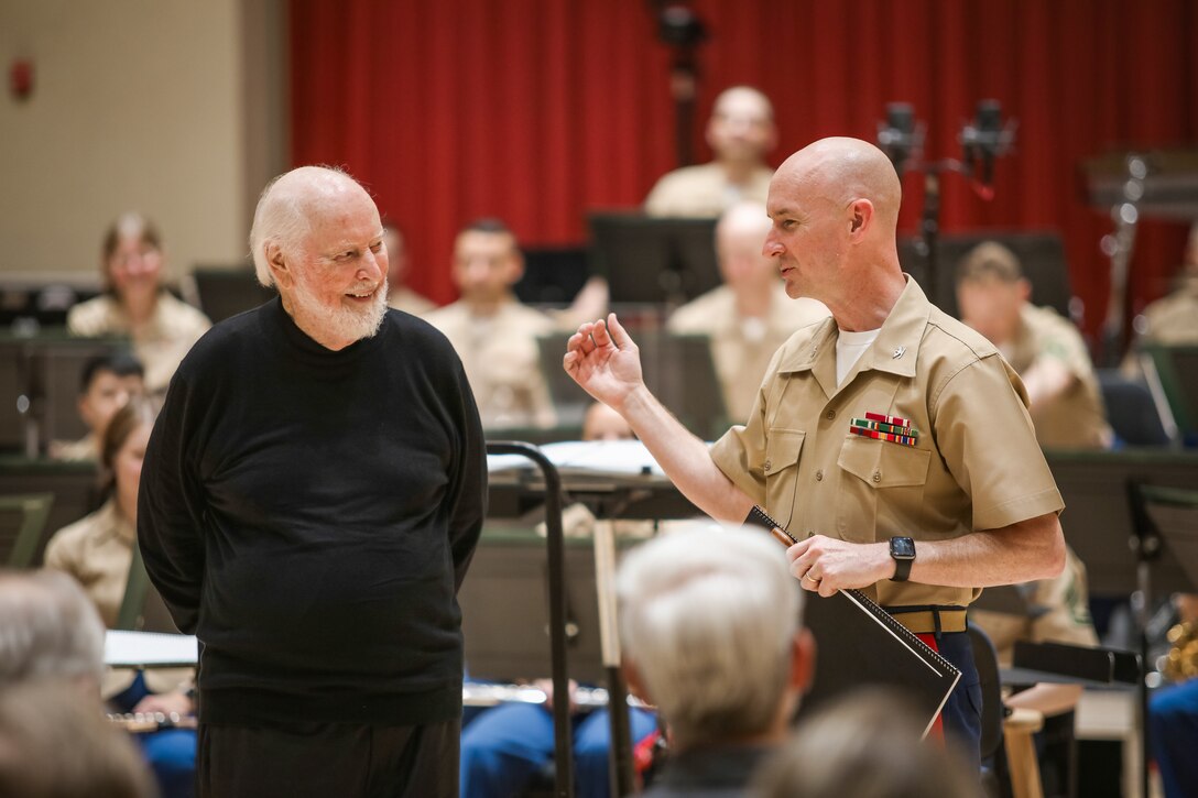 Marine Band Director Col. Jason Fettig thanks John Williams during rehearsal on July 15, 2023, for coming to conduct the band for its 225th anniversary.
(U.S. Marine Corps photo by Gunnery Sgt. Brian Rust/Released)