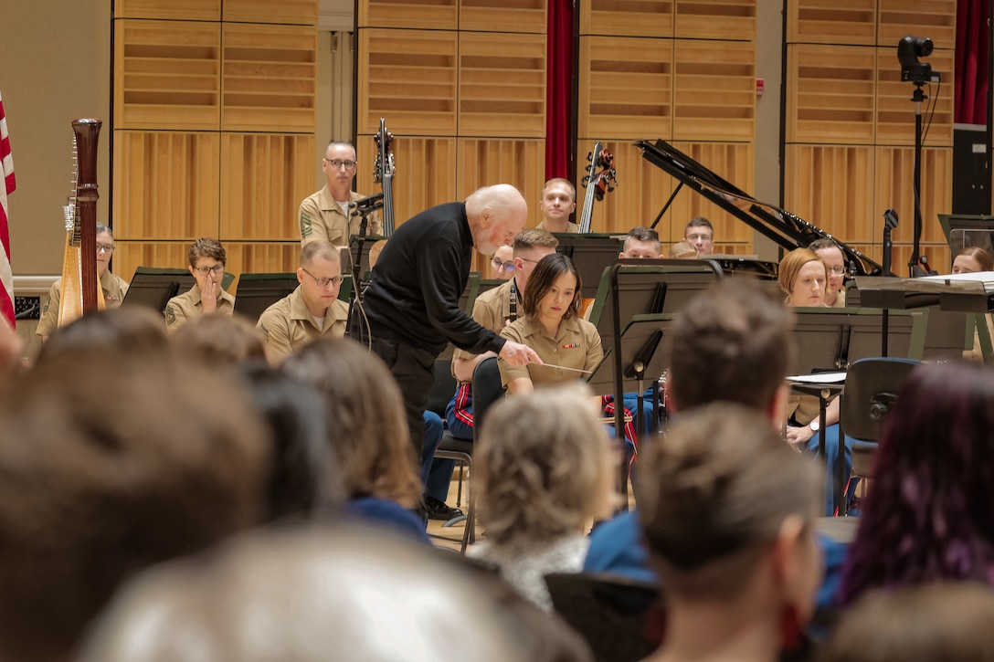 John Williams speaks with Marine Band Flutist Staff Sgt. Christina Hughes at her stand during rehearsal on July 15, 2023.
(U.S. Marine Corps photo by Gunnery Sgt. Rachel Ghadiali/Released)