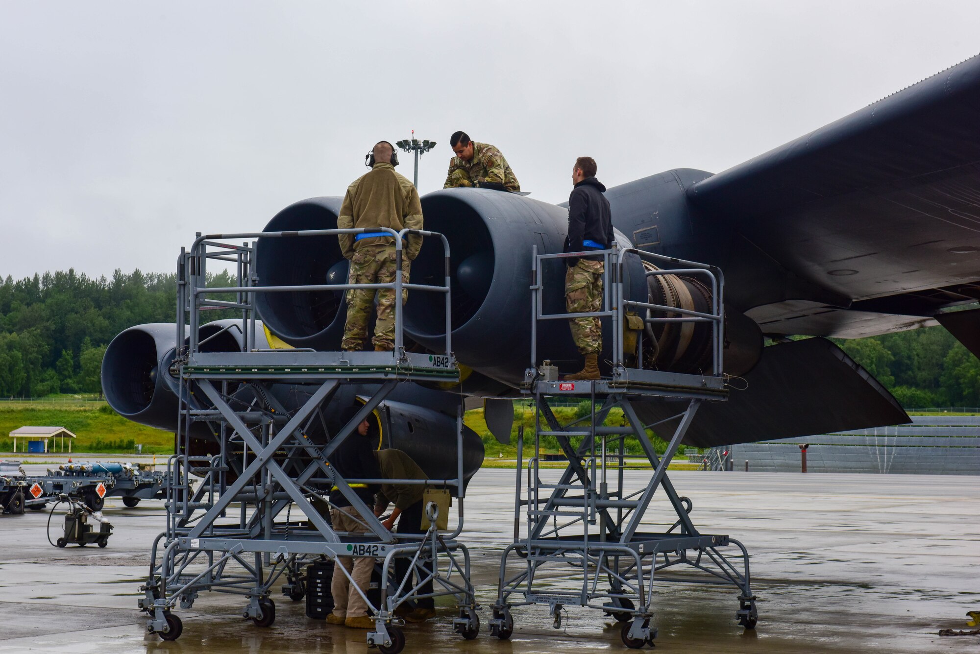 Maintenance Airmen from the 69th Bomb Squadron at Minot Air Force Base, North Dakota, perform maintenance on a B-52H Stratofortress engine at Joint Base Elmendorf-Richardson, Alaska, July 17, 2023. The Airmen from the 69th are responsible for the aircraft’s repair, upkeep and readiness to deploy U.S. Strategic Command assets at a moment’s notice. (U.S. Air Force photo by Senior Airman Zachary Wright)