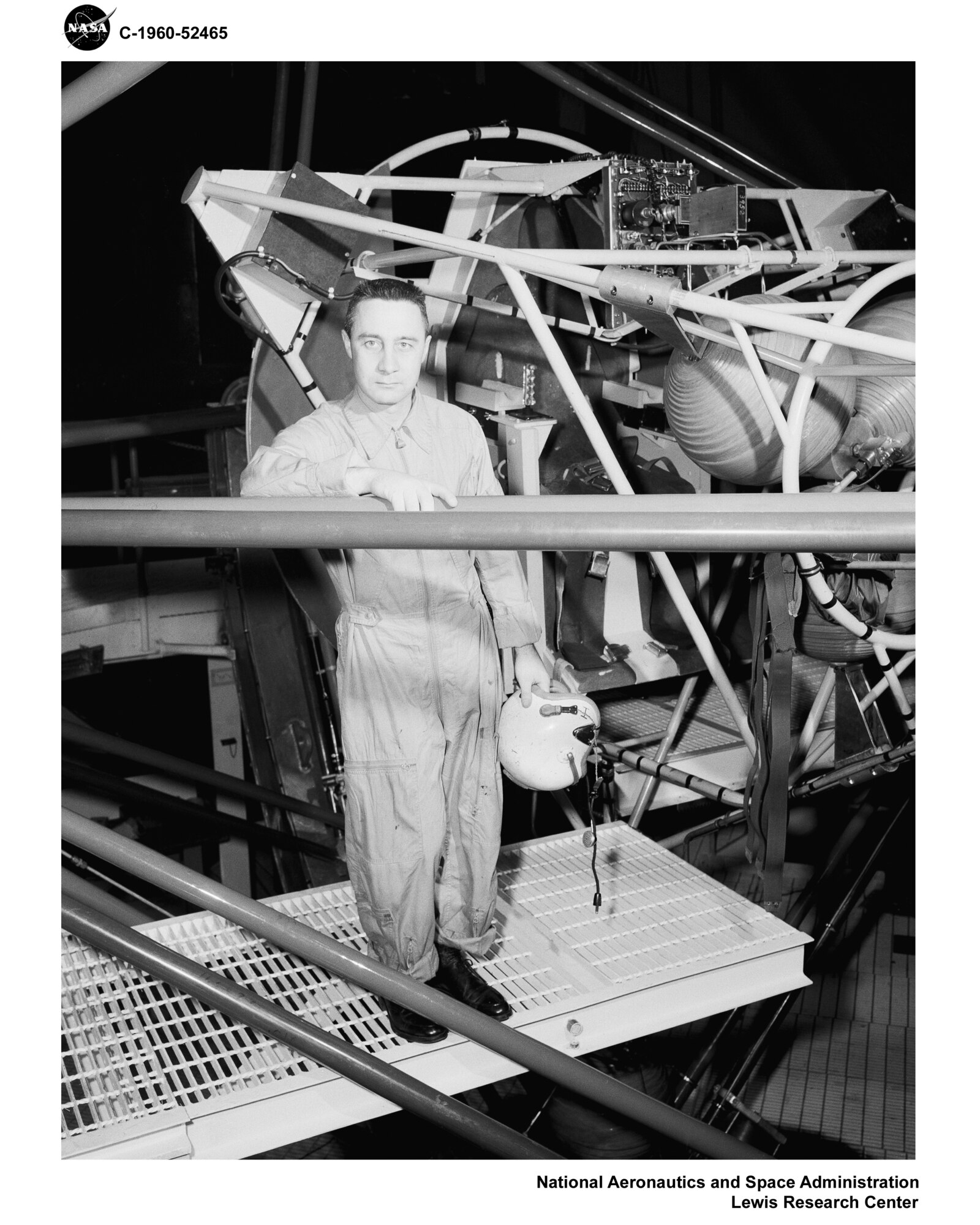 Early astronaut standing by capsule (NASA Courtesy).