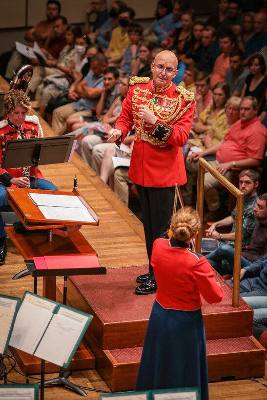Maj. Ryan J. Nowlin conducts the Theme from Schindler's List as Concertmaster Gunnery Sgt. Karen Johnson plays the violin solo during the Marine Band's 225th anniversary concert at The Kennedy Center for the Performing Arts on July 16, 2023. The concert featured the music of composer John Williams, who later conducted the second half of the concert.
(U.S. Marine Corps photo by Gunnery Sgt. Brian Rust/released)
