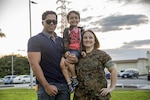 Service member poses with family