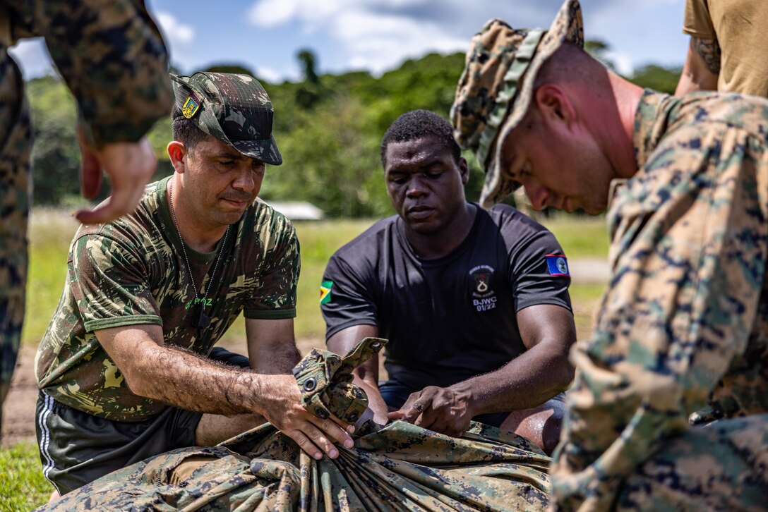 U.S. Marines, Belize Defense Force and Brazilian Army service members conduct jungle training during Tradewinds 2023 at Col. Robert Mitchell Jungle and Amphibious Training School in Guyana, July 16, 2023.