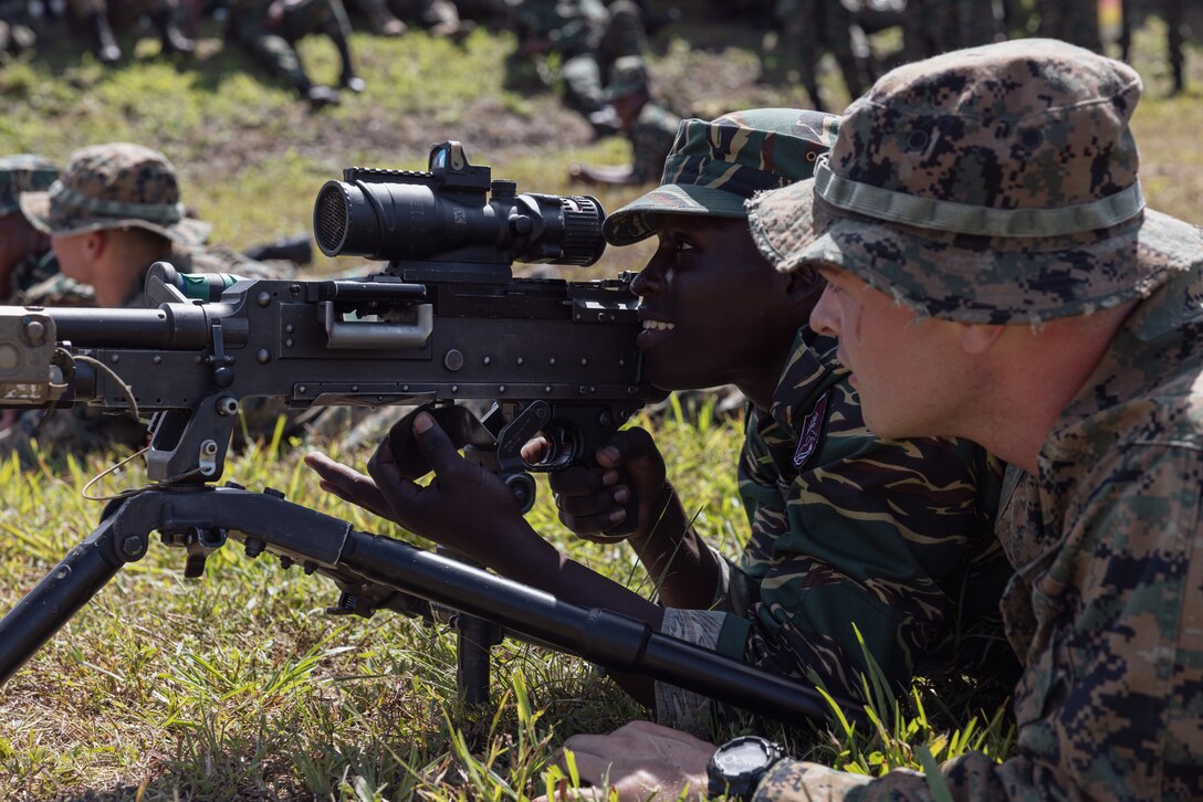 U.S. Marine Corps Lance Cpl. Ian Casado, an infantry Reserve Marine with Fox Company, 2nd Battalion, 25th Marines, instructs multinational forces during training exercise Tradewinds 23 at Camp Seweyo, Guyana on July 17, 2023.