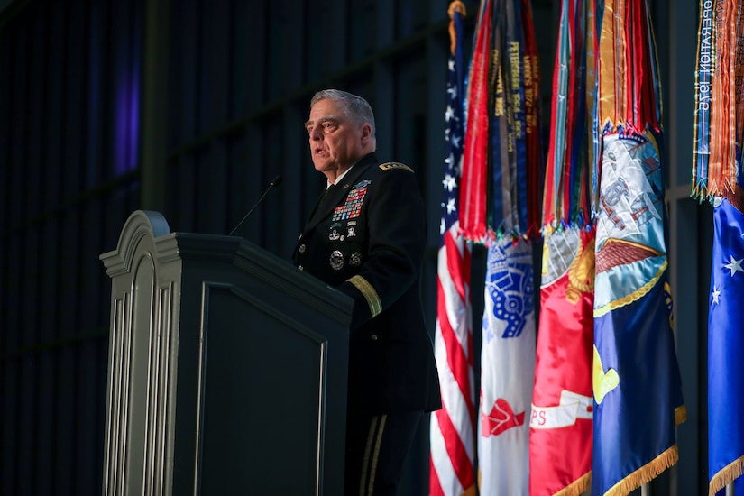 A man in military dress uniform gives a speech.