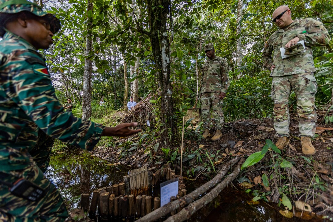 U.S. Army South Commanding General, Maj. Gen. William Thigpen, and Senior Enlisted Advisor, Command Sgt. Maj. Ronald Graves, conduct a battlefield circulation during Tradewinds 2023 at Col. Robert Mitchell Jungle and Amphibious Training School in Guyana, July 16, 2023.