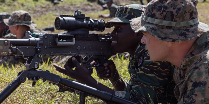U.S. Marine Corps Lance Cpl. Ian Casado, an infantry Reserve Marine with Fox Company, 2nd Battalion, 25th Marines instructs multinational forces during training exercise Tradewinds 23 at Camp Seweyo, Guyana on July 17, 2023.