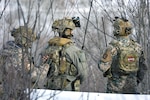 Military personnel from the Latvian National Armed Forces work side-by-side with U.S. Army Soldiers assigned to Battery C, 1st Battalion, 120th Field Artillery Regiment, Wisconsin Army National Guard, while conducting close air support training during Northern Strike 22-1 (“Winter Strike”) at the National All-Domain Warfighting Center, Grayling, Mich., Jan. 27, 2022.