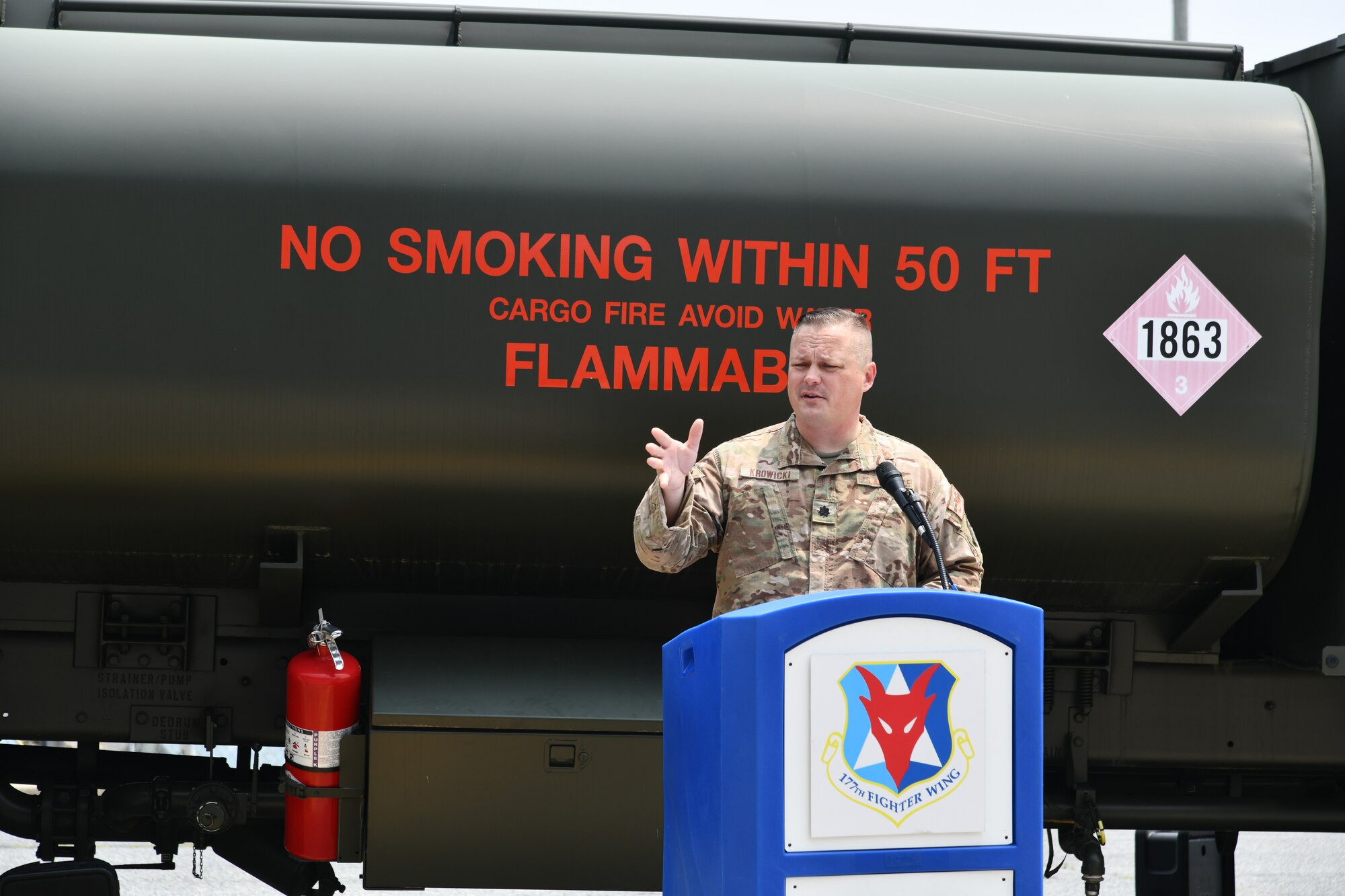 A photo of Lt. Col. Justin Krowicki speaking to a group of Airmen.