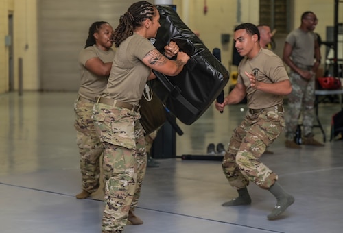 a person prepares to hit another person