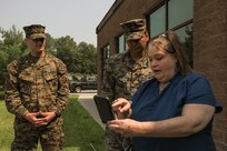 U.S. Marines are thanked by a woman who they assisted during a flash flood