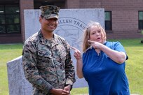 U.S. Marines are thanked by a woman who they assisted during a flash flood