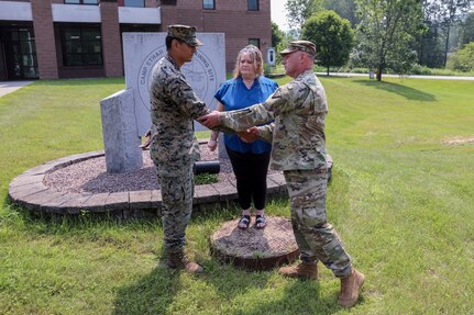 U.S. Marines are thanked by a woman who they assisted during a flash flood