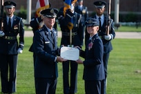 U.S. Air Force Maj. Gen. Joel D. Jackson, left, Air Force District of Washington and 320th Air Expeditionary Wing commander presents Col. Catherine “Cat” Logan, right, outgoing commander of Joint Base Anacostia-Bolling and the 11th Wing, with the Legion of Merit during a change of command ceremony at JBAB, Washington, D.C., July 18, 2023. Logan became the first female commander of JBAB and the 11th Wing in 2021. Under Logan’s command, JBAB reached Full Operating Capability, completed more than $58 million in base infrastructure projects to include quality of life improvements, executed two Air Force 75th Anniversary Tattoo celebrations and deployed personnel for the first time since the lead service transfer in 2020. (U.S. Air Force photo by Kristen Wong)