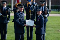 U.S. Air Force Maj. Gen. Joel D. Jackson, left, Air Force District of Washington and 320th Air Expeditionary Wing commander presents Col. Catherine “Cat” Logan, right, outgoing commander of Joint Base Anacostia-Bolling and the 11th Wing, with the Legion of Merit during a change of command ceremony at JBAB, Washington, D.C., July 18, 2023. Logan became the first female commander of JBAB and the 11th Wing in 2021. Under Logan’s command, JBAB reached Full Operating Capability, completed more than $58 million in base infrastructure projects to include quality of life improvements, executed two Air Force 75th Anniversary Tattoo celebrations and deployed personnel for the first time since the lead service transfer in 2020. (U.S. Air Force photo by Kristen Wong)