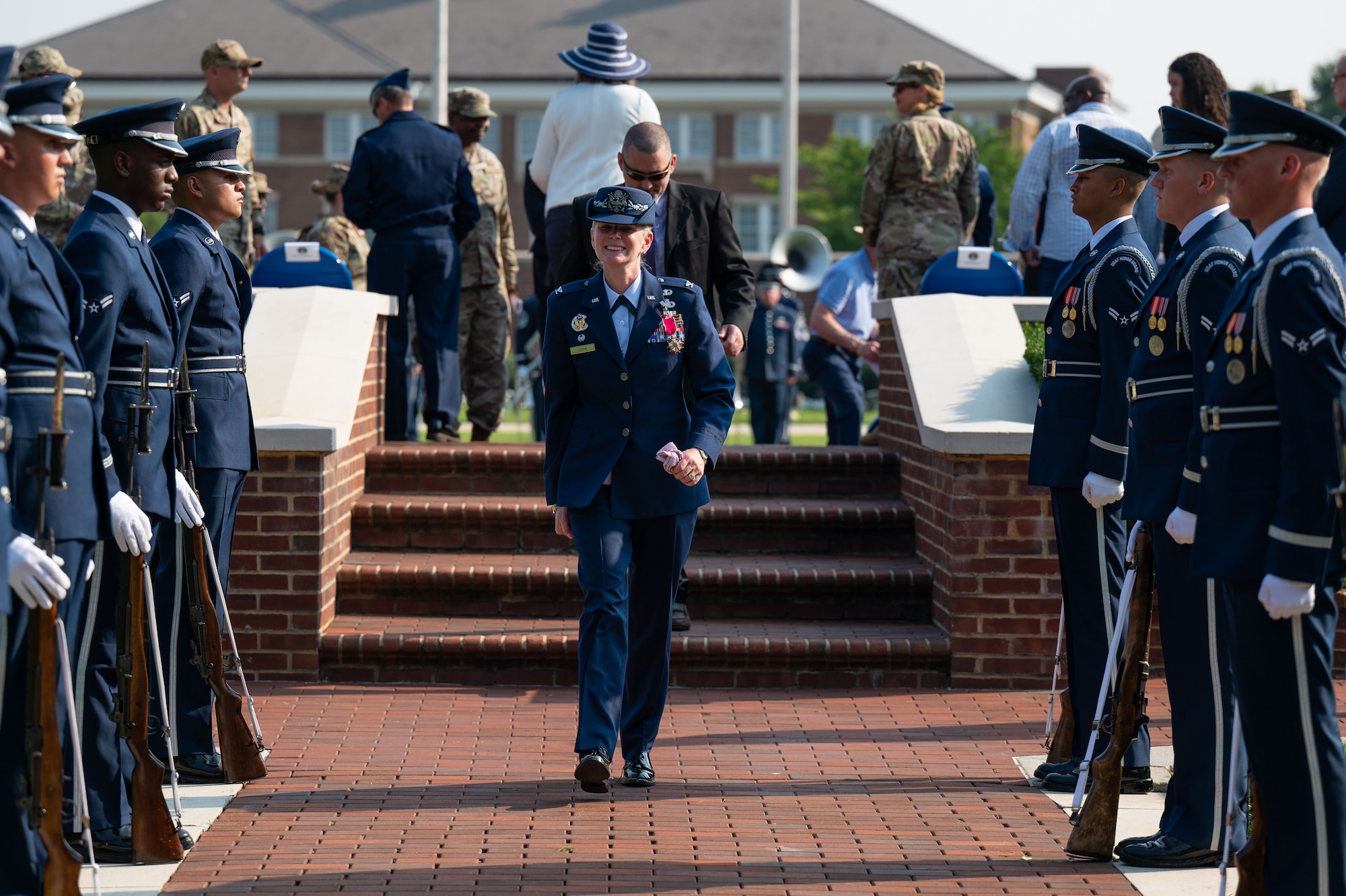U.S. Air Force Col. Catherine “Cat” Logan, outgoing commander of Joint Base Anacostia-Bolling and the 11th Wing, departs the change of command ceremony at JBAB, Washington, D.C., July 18, 2023, after relinquishing command to Col. Ryan A. F. Crowley. Logan became the first female commander of JBAB and the 11th Wing in 2021. Under Logan’s command, JBAB reached Full Operating Capability, completed more than $58 million in base infrastructure projects to include quality of life improvements, executed two Air Force 75th Anniversary Tattoo celebrations and deployed personnel for the first time since the lead service transfer in 2020.  (U.S. Air Force photo by Kristen Wong)