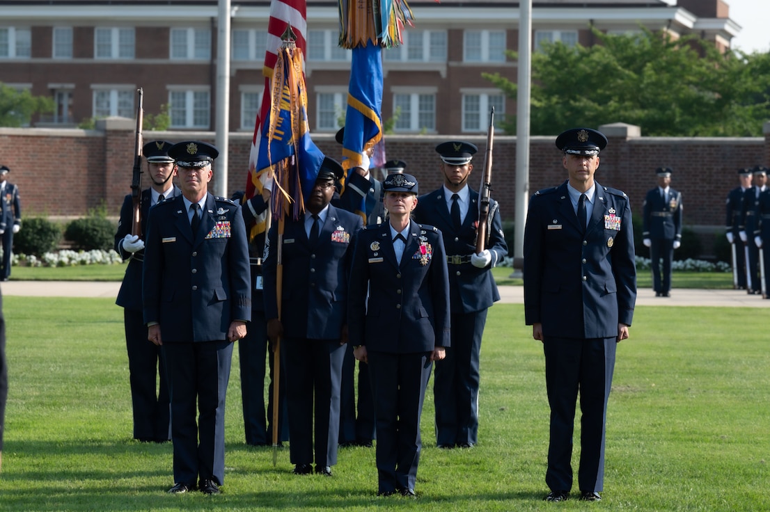 U.S. Air Force Maj. Gen. Joel D. Jackson, left, Air Force District of Washington and 320th Air Expeditionary Wing commander; Col. Catherine “Cat” Logan, center, outgoing commander of Joint Base Anacostia-Bolling and the 11th Wing; and Col. Ryan A. F. Crowley, right, incoming commander of JBAB and the 11th Wing, stand at attention before the passing of the 11th Wing guidon during a change of command ceremony at JBAB, Washington, D.C., July 18, 2023. Logan relinquished command to Crowley, making him the third wing commander at JBAB since the Air Force assumed authority of the installation from the U.S. Navy during the Department of Defense’s first-ever joint base lead service transfer in 2020. (U.S. Air Force photo by Kristen Wong)