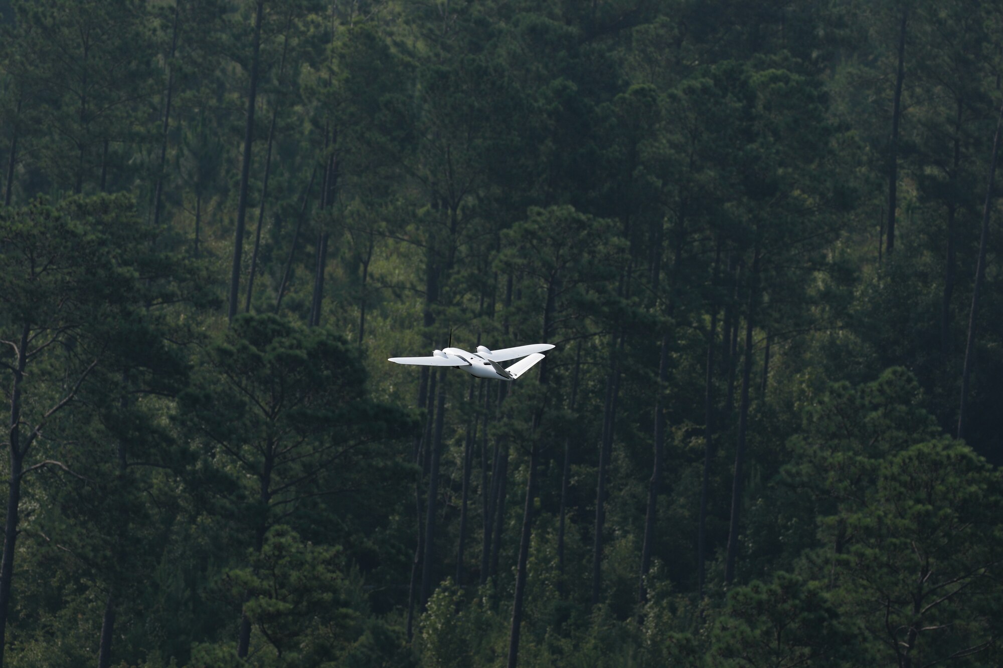 A drone piloted by MITRE in support of CARPE Dronvm testing flies over a testing area in South Carolina. U.S. Army Central tested CARPE Dronvm at McEntire JNGB and Poinsett Weapons Range, S.C., on July 18, 2023. (U.S. Army photo by Sgt. Amber Cobena)