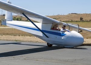 A student in the Glider Orientation Program prepare for a flight in a Schweizer SGS 2-33 glider at Mountain Valley Airport, Tehachapi, June 22. A group of 412th Test Wing engineers became the first group to take part in the Wing’s Glider Orientation Program. (Air Force photo by Giancarlo Casem)