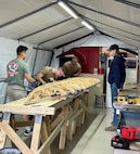 United States Naval Academy Midshipmen assist with the construction of a Low Profile Vessel at Trine University.