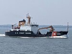 Coast Guard Cutter Aspen transits through the Kachemak Bay, Alaska, July 17, 2023. Aspen will be filling the role of the “Bull of the North,” replacing Coast Guard Cutter Hickory as Homer’s 225-foot Juniper class buoy tender responsible for servicing aids throughout the Kenai Peninsula and north of the Aleutian chain. Coast Guard courtesy photo.