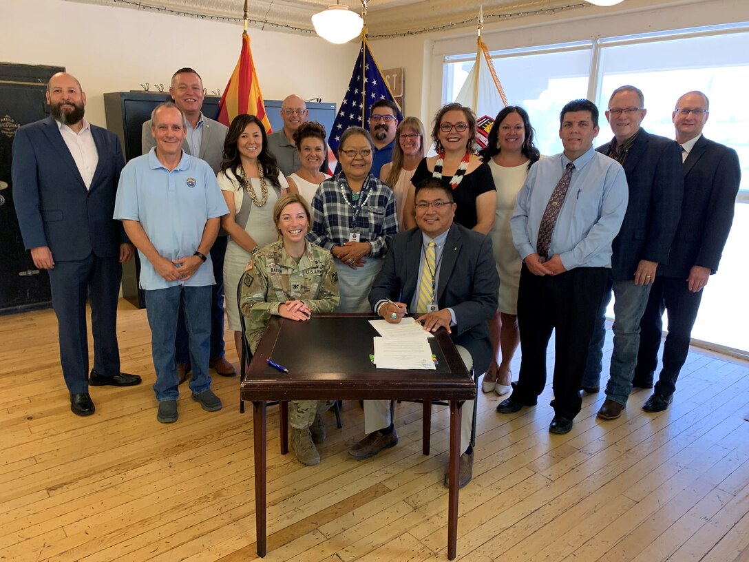 The U.S. Army Corps of Engineers Los Angeles District, along with the Navajo County Board of Supervisors and Winslow city leaders, pose for a picture before signing the Little Colorado River at Winslow Flood-Risk Management Project Design Agreement July 11 at the Winslow Chamber of Commerce in Winslow, Arizona. The signing ceremony marks the Corps’ initiation of pre-construction, engineering and design to reduce potential flood risk along the Little Colorado River in Winslow.