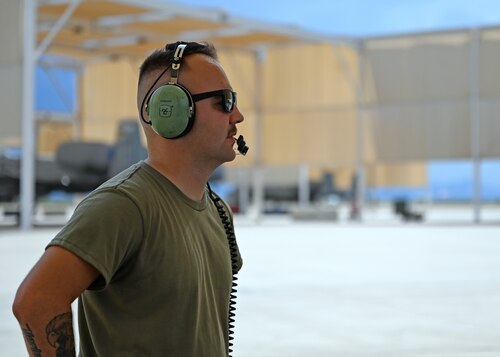 U.S. Air Force Senior Airman Thomas Snyder, 357th Fighter Generation Squadron crew chief, waits for the arrival of an A-10C Thunderbolt II aircraft at Davis-Monthan Air Force Base, Ariz. July 17, 2023. On July 4, 2023, Snyder provided first aid response to a critically injured Tucson community member who was in a motorcycle accident. (U.S. Air Force photo by Staff Sgt. Abbey Rieves)