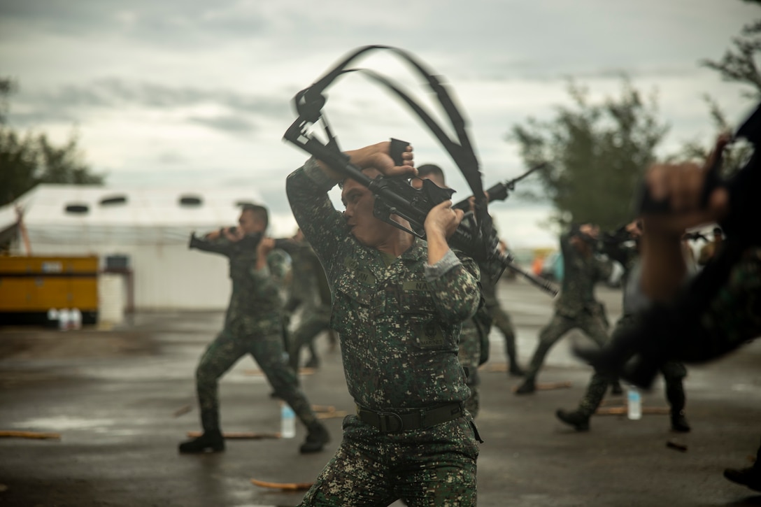 A Philippine Marine with Battalion Land Team 4 performs a Marine Corps Martial Arts technique during Marine Aviation Support Activity 23 at Parades Air Station, Philippines, July 14, 2023. MASA is a bilateral exercise between the Armed Forces of the Philippines and the U.S. Marine Corps, aimed at enhancing interoperability and coordination focused on aviation-related capabilities. During MASA 23, Armed Forces of the Philippines and U.S. Marines conduct approximately twenty different training evolutions, including live-fire, air assaults, and subject matter expert exchanges across aviation, ground, and logistics capabilities.