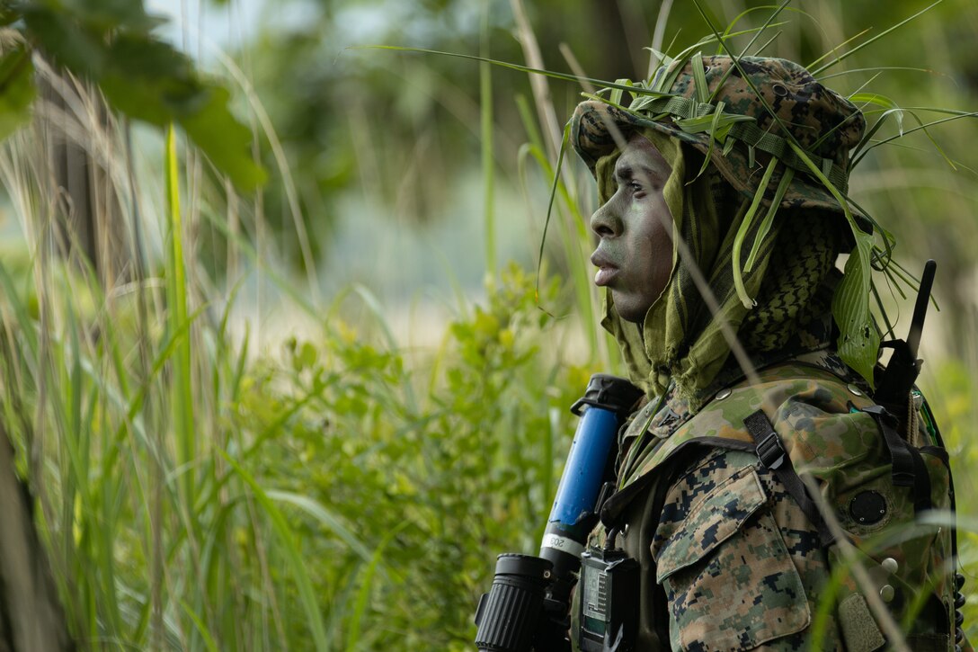 U.S. Marine Corps Lance Cpl. Dominique Hayes provides security while on patrol during Exercise Shinka 23 at Combined Arms Training Center Camp Fuji, Japan, June 27, 2023. Shinka is the largest force-on-force exercise between the U.S. Marine Corps and the JGSDF that produces adaptable forces capable of decentralized execution. Hayes, a native of Angier, North Carolina, is a rifleman with 3d Battalion, 6th Marines and is forward deployed in the Indo-Pacific under 4th Marines, 3d Marine Division as part of the Unit Deployment Program.