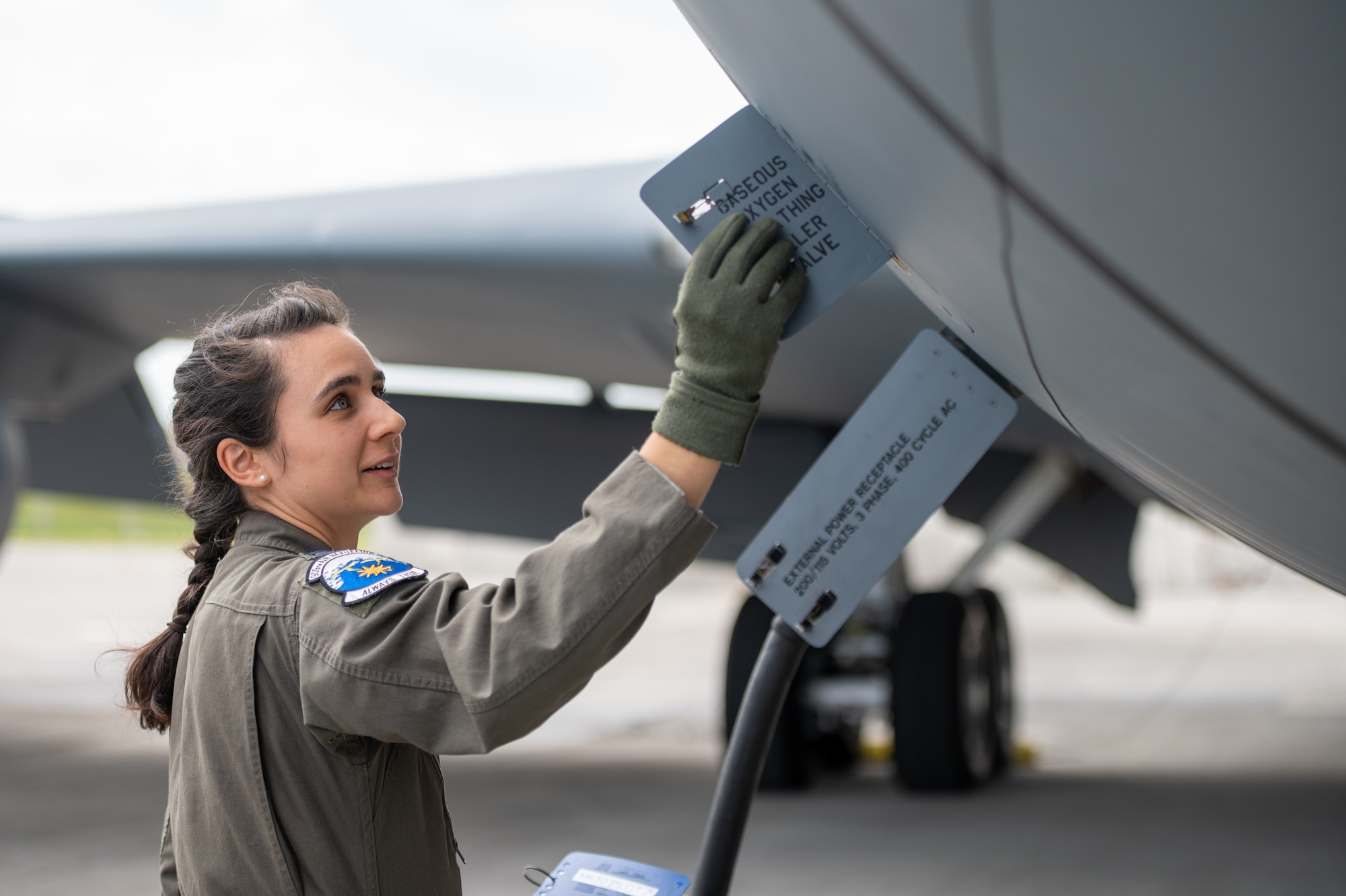U.S. Air Force Capt. Jessica Wallande conducts a preflight check on a KC-135 Stratotanker at Kadena.