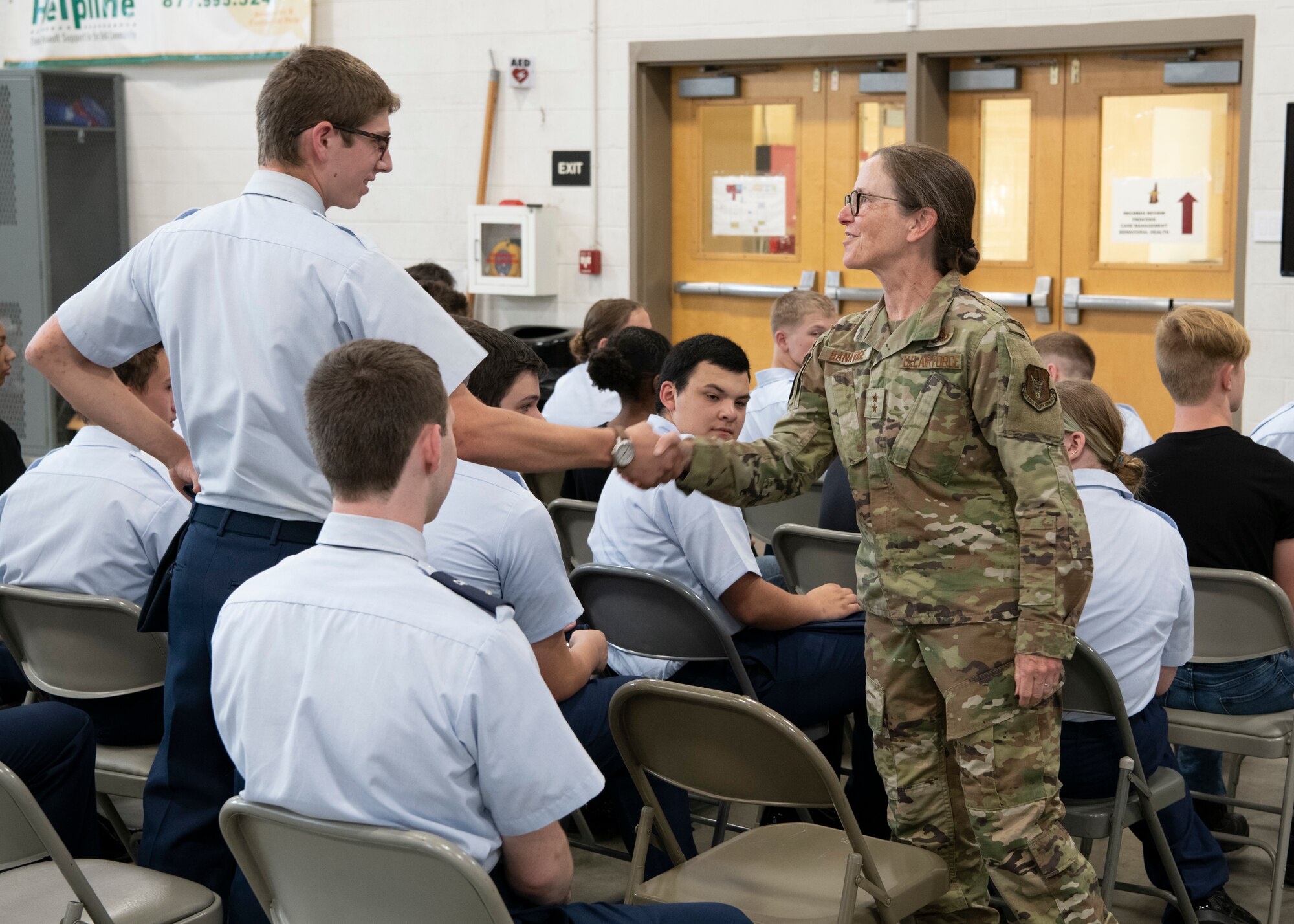 Civil Air Patrol cadet shakes hands with Air Force Reserve leadership