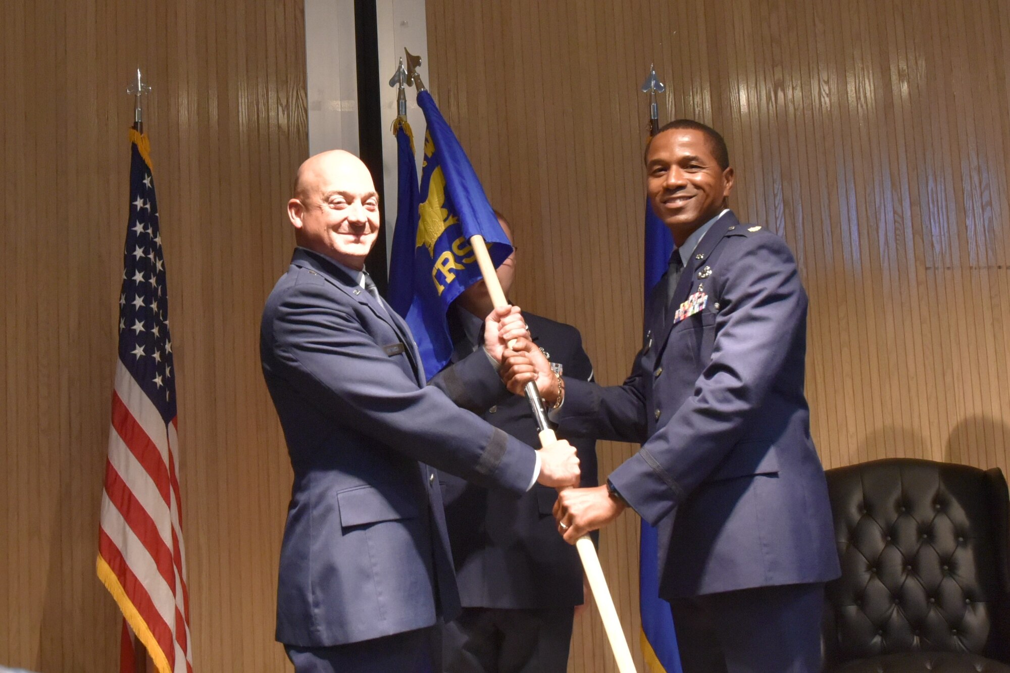 U.S. Air Force Brig. Gen. George Dietrich III hands the 82d TRSS guidon to Maj. W. Frank Larkins as he assumes command of the squadron.