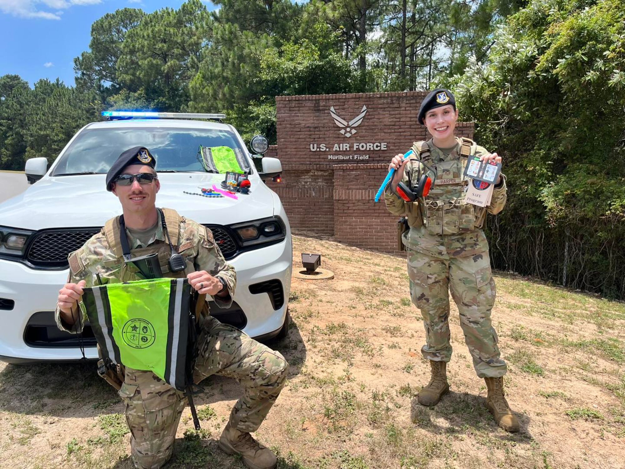 U.S. Air Force security forces showcase the contents of the SAFE program bag at Hurlburt Field, Florida. The program aims to enhance communication and cooperation between first responders and individuals with disabilities, ultimately ensuring the safety and well-being of the community.