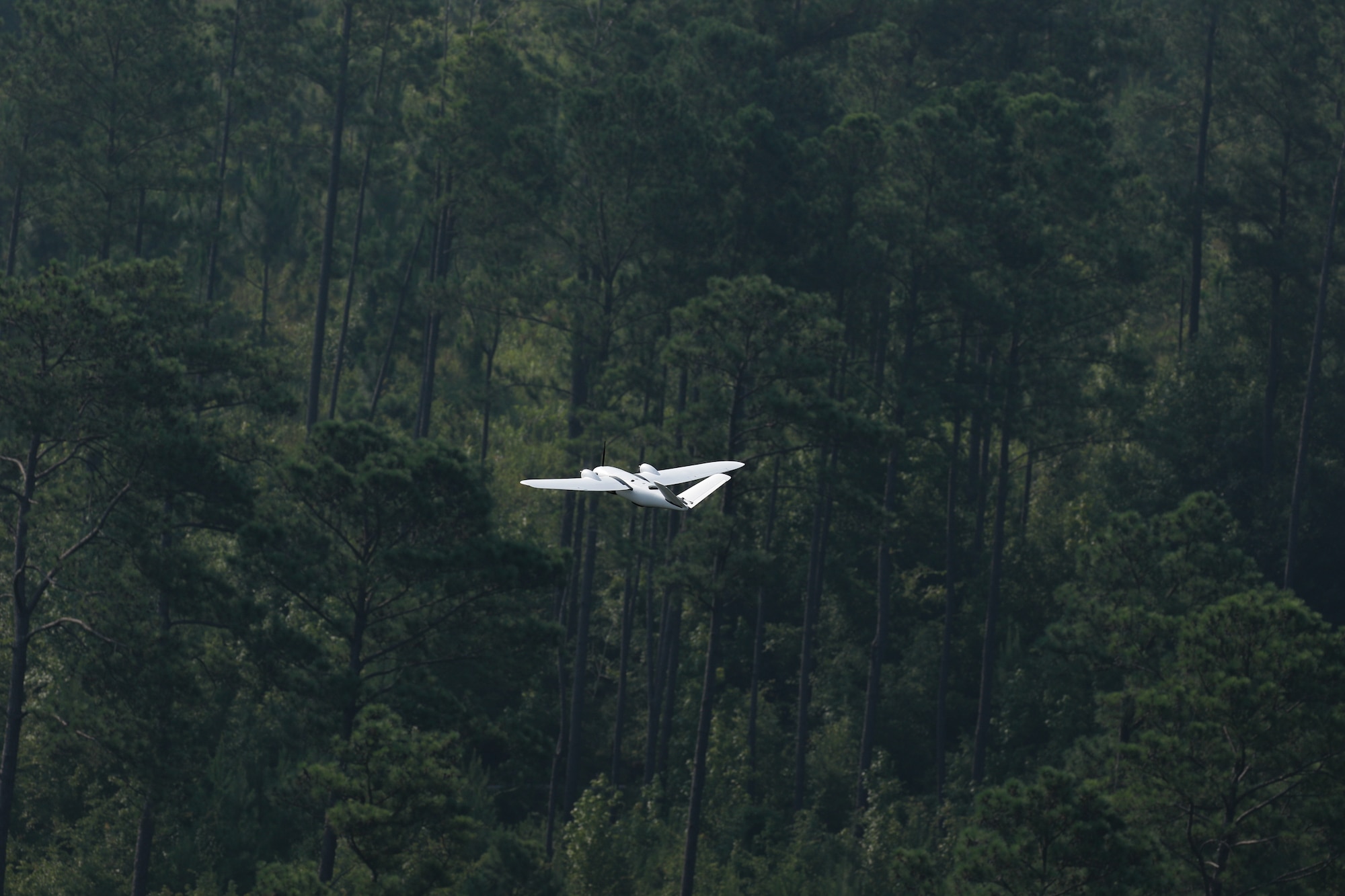 A drone piloted by MITRE in support of CARPE Dronvm testing flies over a testing area in South Carolina. U.S. Army Central tested CARPE Dronvm at McEntire JNGB and Poinsett Weapons Range, S.C., on July 18, 2023. (U.S. Army photo by Sgt. Amber Cobena)