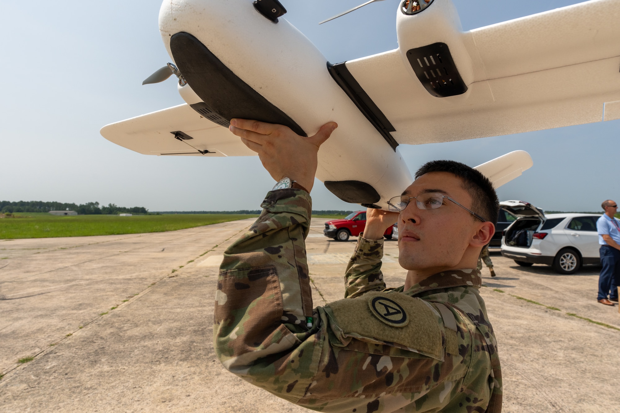 Sgt. Mickey Reeve, operations NCO for USARCENT's Task Force 39, prepares to launch a drone during the CARPE Dronvm app test at McEntire Joint National Guard Base, S.C., on July 17, 2023. (U.S. Army photo by Staff Sgt. Leo Jenkins)